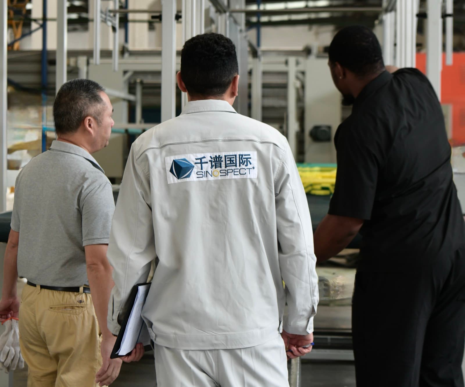 Sinospect inspector walking a Chinese supplier's production floor during qualification