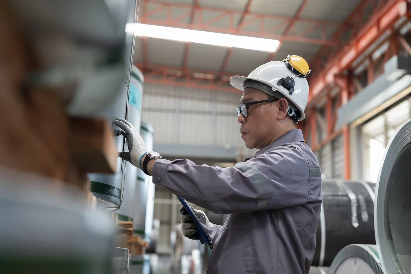 Quality inspector verifying industrial equipment in Chinese factory